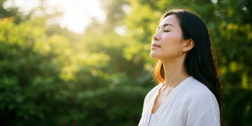 Woman practicing deep breathing outdoors for resilience